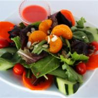 Saffron Salad · Fresh mixed green, tomatoes, cucumber, mandarin oranges, almond silvers and served with fres...