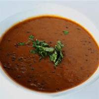 Daal Makhani · Black lentils slowly simmered with traditional spices, a specialty of the Northwest Indian f...