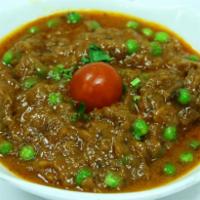 Baingan Bharta · Traditional smoked eggplant cooked with fresh green chilis, ginger root & fresh coriander le...