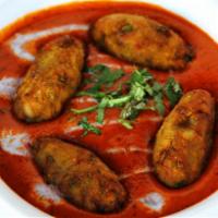 Malai Kofta · Vegetable rolls simmered in tomato & cream sauce. Accompanied with saffron rice. Gluten free.