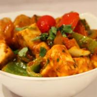Karhai Paneer · Homemade cubes of cheese seasoned with exotic fenugreek leaves, onions, bell peppers & cooke...
