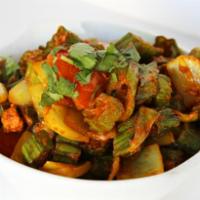 Bhindi Do Pyaza · Okra sauteed in cumin seeds, onions & tomatoes. Accompanied with saffron rice. Gluten free a...