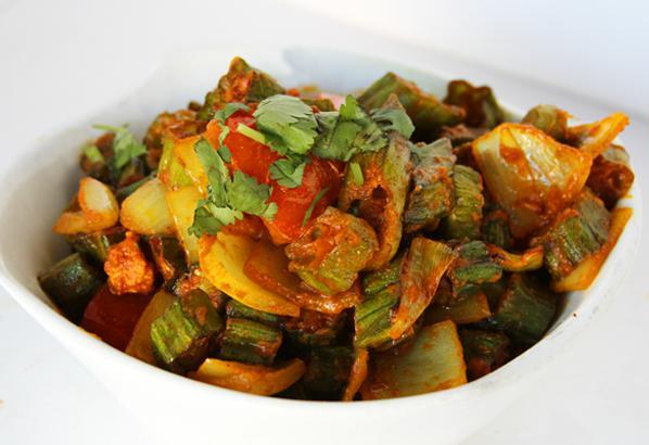 Bhindi Do Pyaza · Okra sauteed in cumin seeds, onions & tomatoes. Accompanied with saffron rice. Gluten free and vegan.