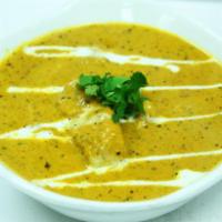 Saffron Mulghai · Our exotic curry infused with ginger, garlic and tossed with onions and bell peppers. Accomp...