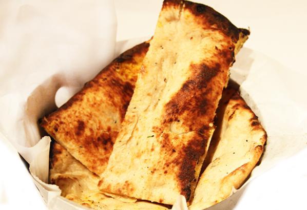 Paneer Naan · Homemade cheese stuffed in a soft naan. Baked in our traditional clay tandoor oven from India.