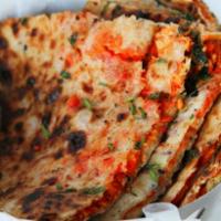 Chicken Tikka Naan · Soft naan stuffed with chopped chicken tikka. Baked in our traditional clay tandoor oven fro...