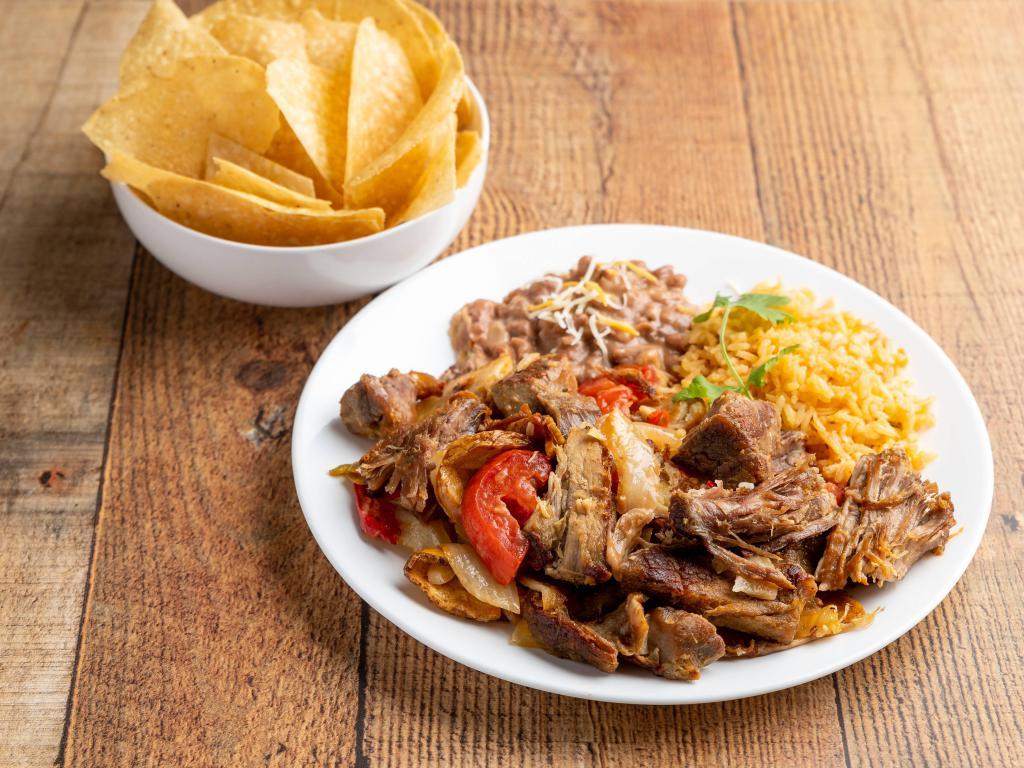 Carnitas · Charbroiled marinated pork tips, topped with fried onions, bell peppers and fresh tomatoes. Potatoes served with guacamole, pica de Gallo, rice, beans and flour tortillas.
