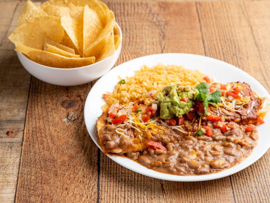 Burrito Dinner · A soft flour tortilla filled with beef, covered with chilli con carne and cheese. Served with guacamole, rice and beans.