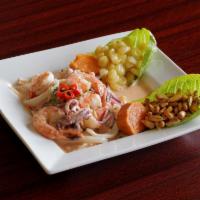 10. Ceviche Mixto · Made with raw fish and seafood briefly marinated in lime juice and seasoned with Peruvian ho...