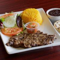 21. Carne Asada · Marinated steak grilled with mixed rice and beans, pico de gallo and 2 homemade tortillas. S...