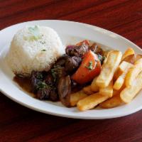 23. Lomo Saltado · Peruvian dish with strips of sirloin marinated in vinegar, soy sauce and spices, then stir-f...