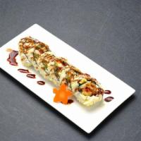 SALMON Tempura Roll ·  Roll Fried salmon, cucumber, avocado, crab meat with eel sauce & tempura flakes on top.