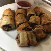 Philly Cheese Steak Egg Roll · Comes with 4 served with mango chili sauce on the side.