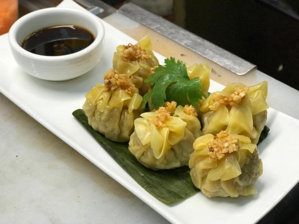 Thai Dumpling · Steamed chicken and shrimp dumpling with dumpling sauce.