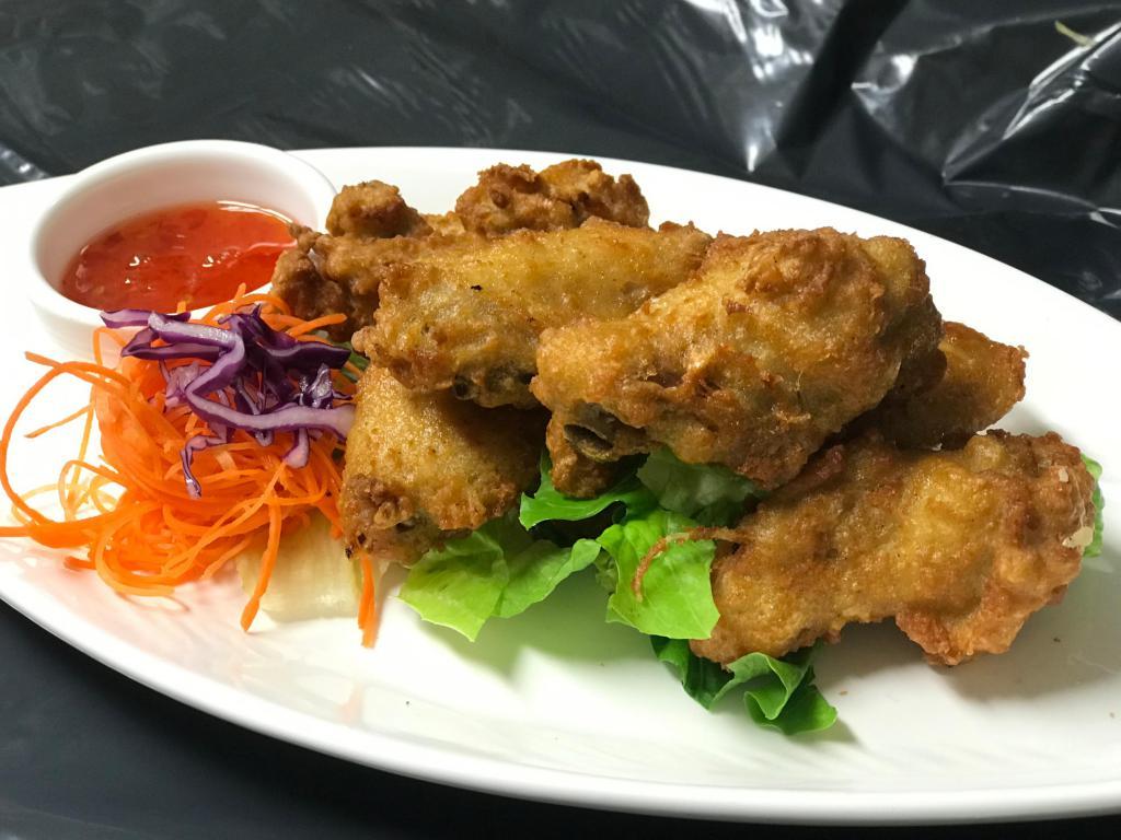 Chicken Wing · Fried marinated wings with sweet chili sauce.