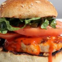 Buffalo Chicken Sandwich · Antibiotic-free chicken breast, buffalo sauce, lettuce, tomatoes, blue cheese dressing