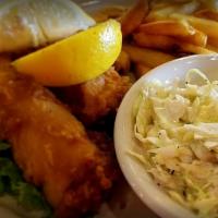 Fish & Chips · North Atlantic Cod, served with our signature tartar sauce, crispy fries & Cole slaw on the ...