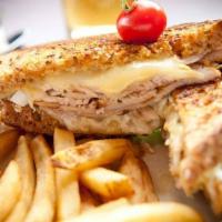 Turkey Reuben · Roasted turkey breast, Swiss cheese, homemade Thousand Island dressing and coleslaw on grill...
