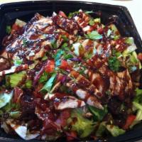 Baja BBQ Chicken Salad · Fresh salad greens and kale, onion, bell pepper, jicama, tortilla strips, roasted corn, blac...
