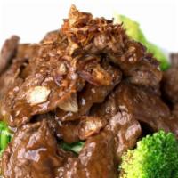 Beef in Hoi Sin Sauce · Stir-fried beef in Asian style with hoi-sin sauce bed on broccoli and Shanghai choy. Garnish...