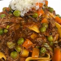 Short Rib Bolognese · short rib, fresh pappardelle pasta, aromatic vegetables, peas, plum tomato sauce