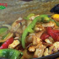 Chicken Fajitas · Strips of seasoned chicken grilled with onions and bell peppers. Served with rice, beans, fl...