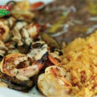 Camarones al Chipotle · Grilled jumbo shrimp served in a spicy chipotle sauce with onions and mushrooms and flour or...