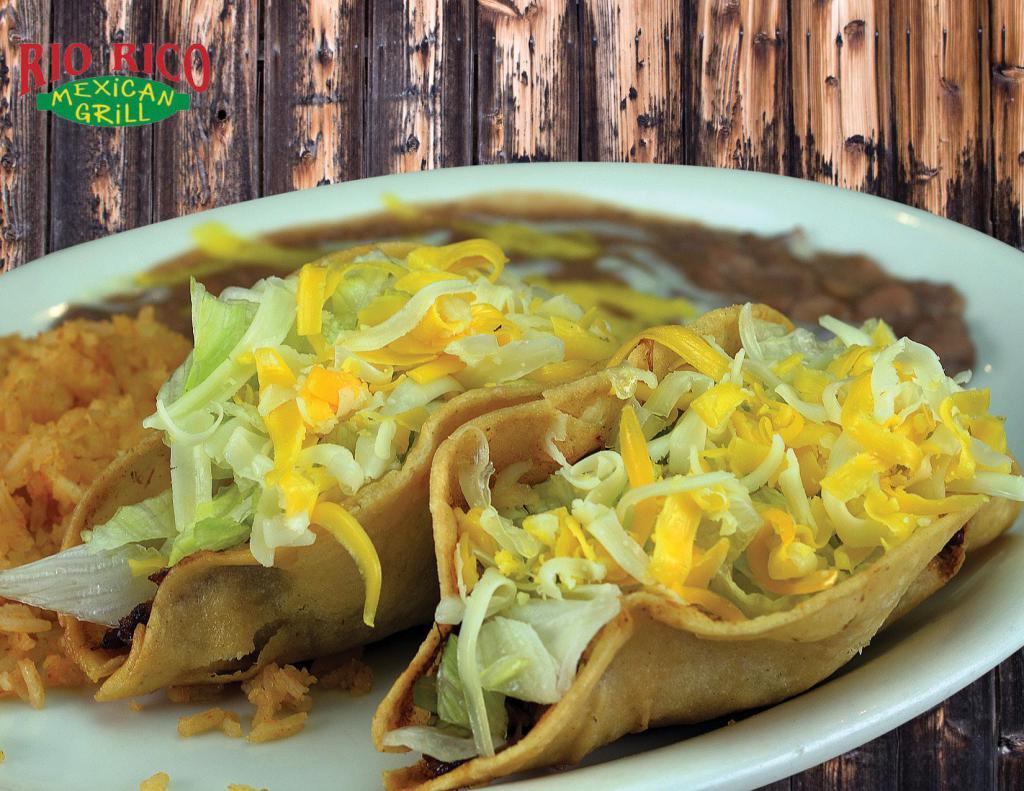 Two Tacos Combo Plate (#15) · Shredded chicken, shredded beef or ground beef tacos on crispy corn tortilla shells. Served with rice and beans.