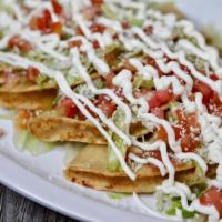 4 Tacos de Papa Special · Lettuce,sour cream,cheese,tomato
 & green salsa