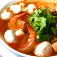 Tom Yum Noodle Soup · Rice, noodles and vegetables in a special sauce topped with roasted peanut and spicy lime ju...
