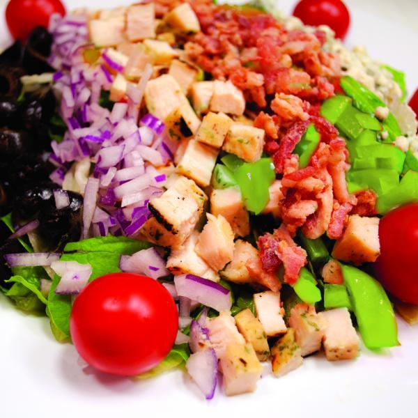 Chopped Salad · Romaine lettuce, pasta, chicken, bacon, Gorgonzola, red onion, green pepper, grape tomatoes and croutons.