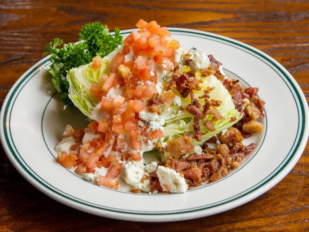 The Wedge Salad · Iceberg, blue cheese, bacon, tomatoes and blue cheese dressing.