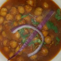 Chana Masala · Chickpeas cooked in onion tomato sauce and Nepali herbs.