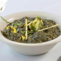 Saag Paneer · Spinach cooked with cubes of cottage cheese delicately spiced and garnished with chopped gin...