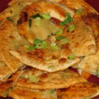 Scallion Pancake · Meatless, glutinous flour stuffed with scallions and herbs then pan-fried until brown served...