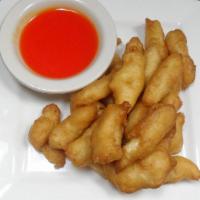 Sweet and Sour Chicken · Chicken fingers with sweet and sour sauce on the side.