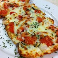 Bruschetta · Warm, toasted Italian bread topped with tomatoes, onions, basil, roasted peppers and mozzare...