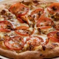 White Knight Pizza · Mozzarella, ricotta cheese, fresh tomatoes, garlic, and oregano.