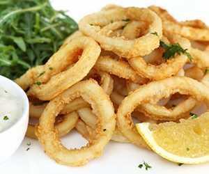 Fried Calamari · Lightly fried crispy calamari, served with calamari sauce.