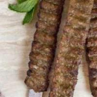 Lamb Adana · Ground lamb seasoned with red bell peppers, herbs and spices. Gluten free.