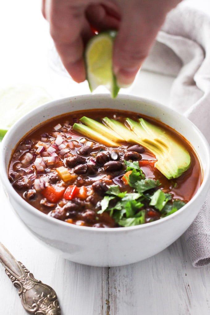 Black Bean Soup · Vegetarian soup with tasty black beans, onions, avocado, garlic, lime and bell peppers.