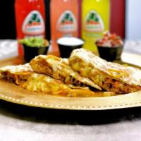 Quesadilla · Melted Jack cheese in a flour tortilla served with fresh chopped tomato salsa, guacamole and...