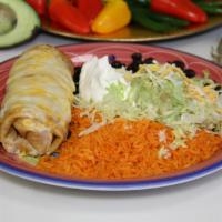 Chimichangas · Fried burrito with chicken, steak or chili meat. Topped with melted cheese, sour cream and g...