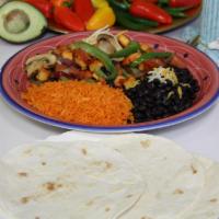 Fajita Platter · Charbroiled chicken or steak on a plate with sauteed mushrooms, bell peppers, tomatoes and o...
