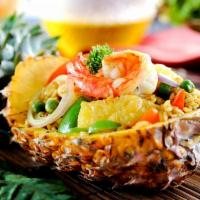 Pineapple Fried Rice · Served fried steamed rice with meat, egg, onion, carrot, cashew nut, pineapple scallion in o...