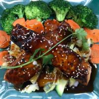 Salmon Teriyaki · Served grilled salmon two pieces on top with our homemade teriyaki sauce, sesame seed, stem ...