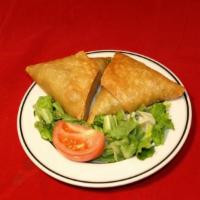 Meat Samosa (2) · Triangular shaped savory pastries filled with ground lamb with peas.