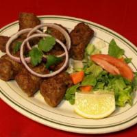 Seekh Kabab · Minced lamb cooked on skewers with herbs and spices.