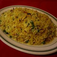Fried Rice · Basmati rice cooked with almonds, green peas and raisins.