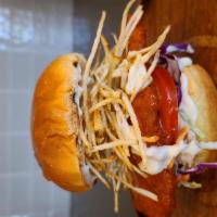 Buffalo Chicken Sandwich · Spicy buffalo sauce breaded chicken with mix cabbages, tomatoe snd shoestring fries, topped ...